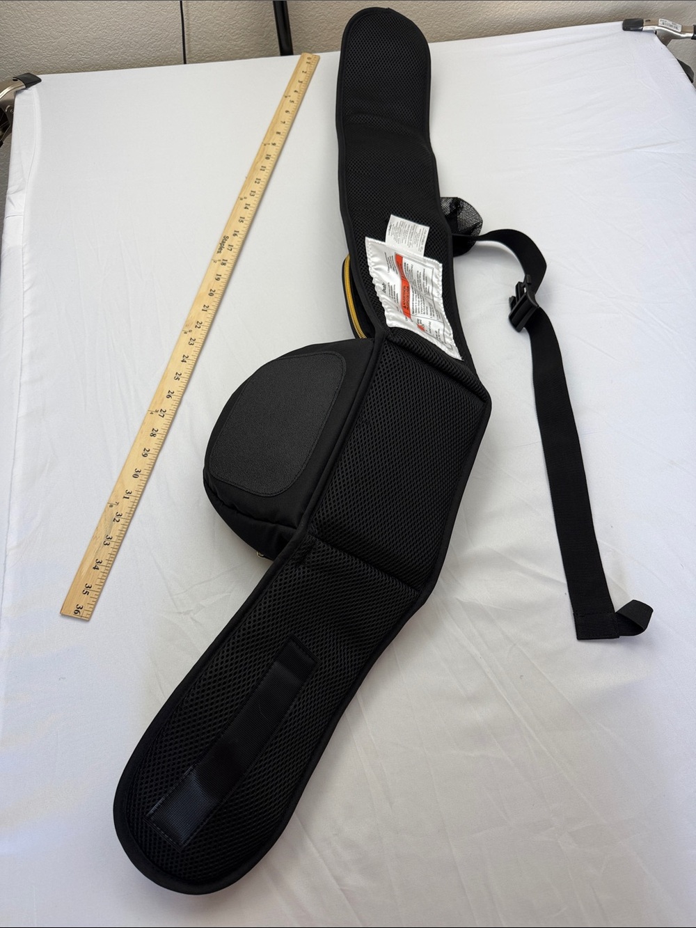 Tushbaby ergonomic hip carrier in black with gold hardware. Adjustable - Picture 3 of 9